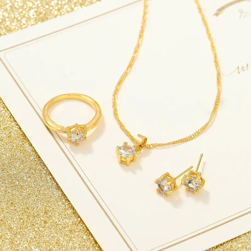 4PCS Set Elegant Gold-Plated Jewelry Set for Women: Ring, Earrings, and Pendant Necklace â Simple, Exquisite Design.