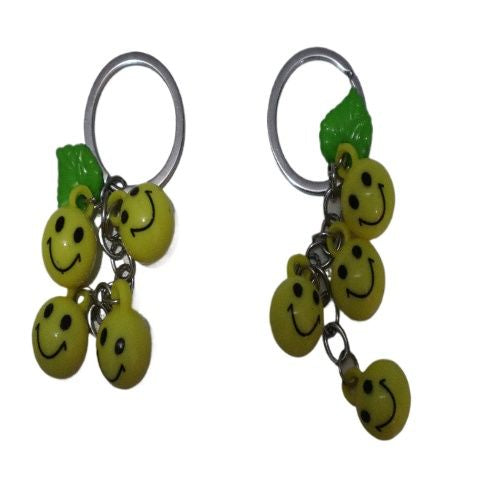 Bright Yellow Smiley Face Ball Keychain with Green Leaf Accent - Durable Plastic Design. - Abid Cart
