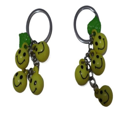 Bright Yellow Smiley Face Ball Keychain with Green Leaf Accent - Durable Plastic Design. - Abid Cart